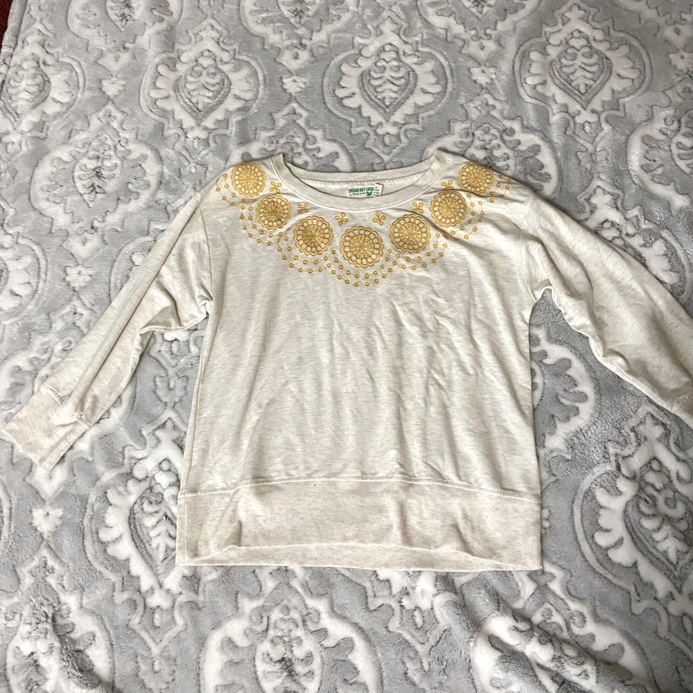 Cream shirt with mustard yellow flowers, Dream Out Loud by Selena Gomez